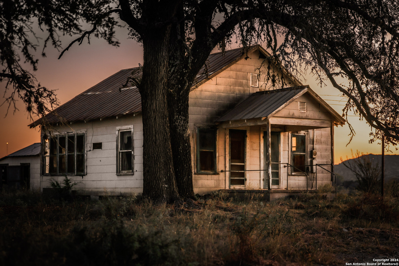 91 Waring Welfare Road Boerne, TX 78006 - Photo 19 of 31 a front view of a house with garden