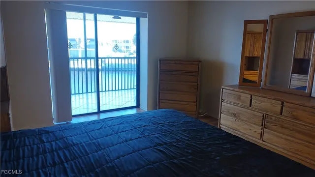 a view of an empty room with a dresser