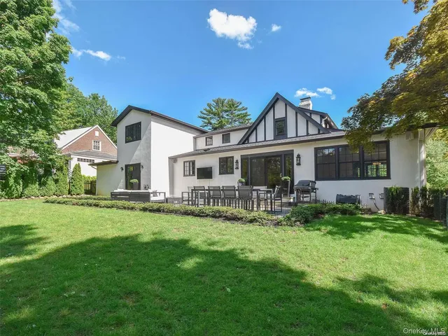 a front view of house with yard and seating area