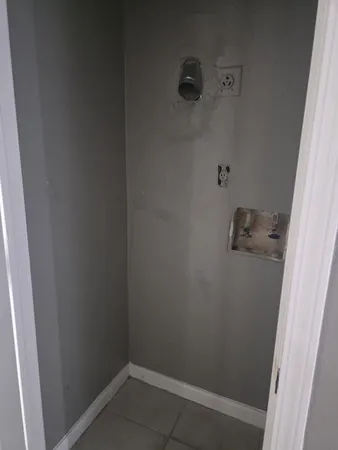 an empty room with a shower