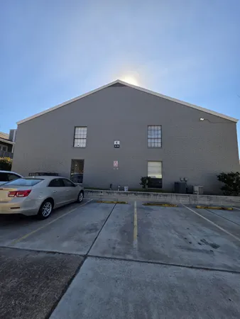 a view of parking area and car parked