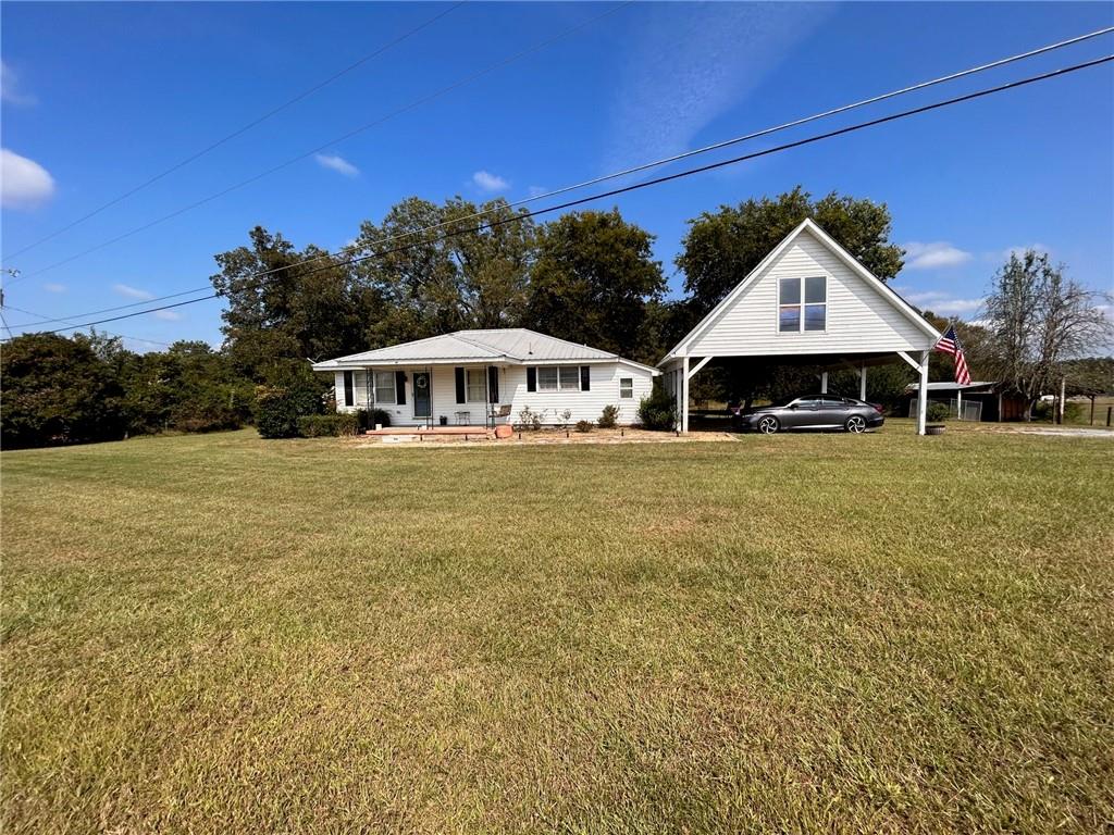 236 McCreary Road Southeast Calhoun, GA 30701 - Photo 1 of 1 a front view of a house with garden