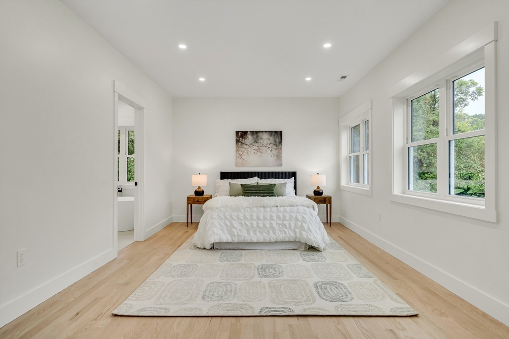 22 Estabrook Road Lexington, MA 02421 - Photo 21 of 36 a bedroom with a large bed and a window