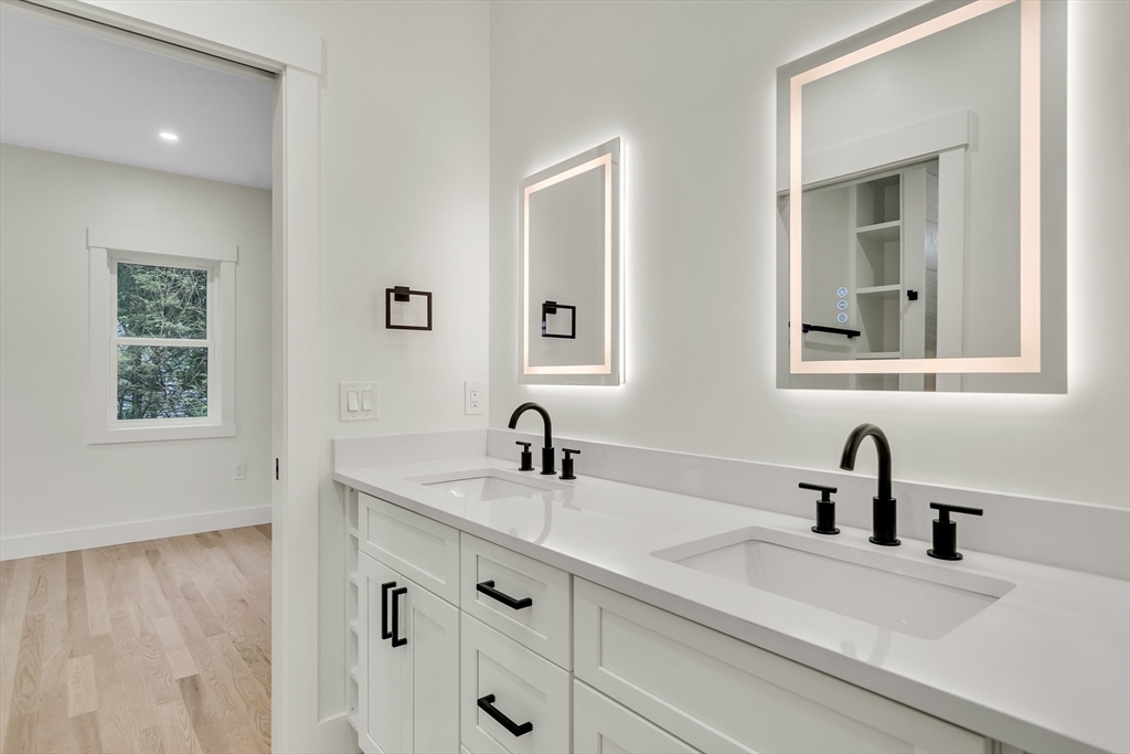 22 Estabrook Road Lexington, MA 02421 - Photo 25 of 36 a bathroom with double vanity sink two mirror and window
