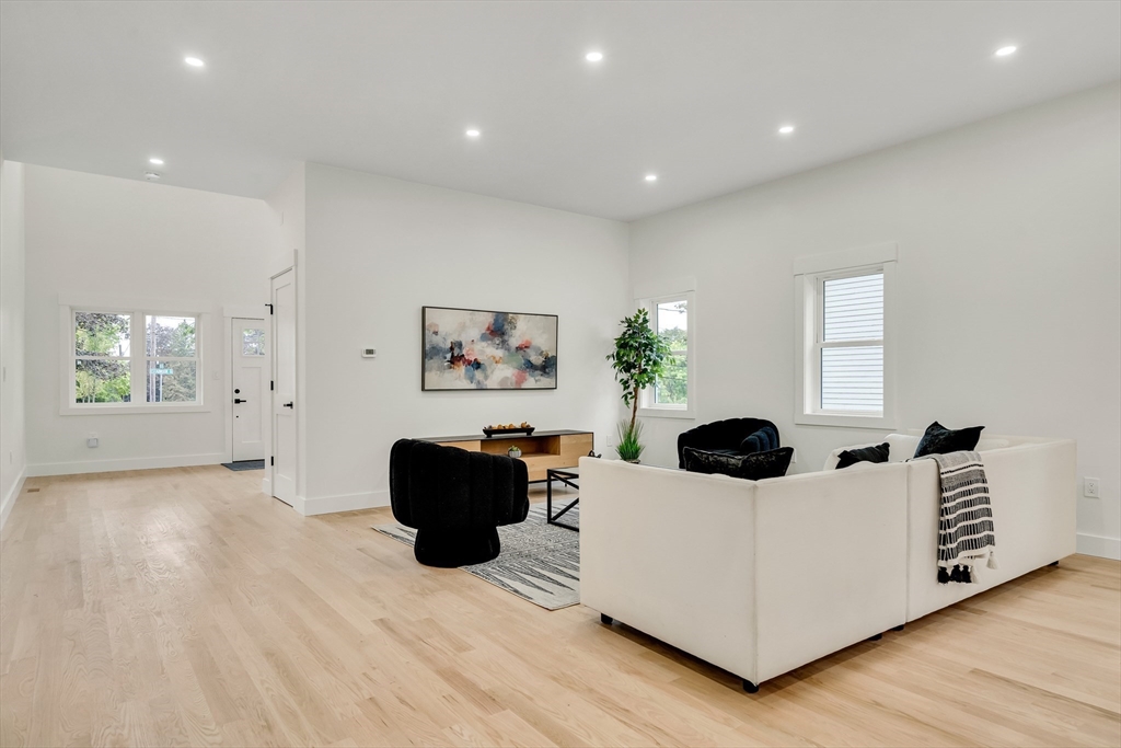 22 Estabrook Road Lexington, MA 02421 - Photo 9 of 36 a living room with furniture and a window