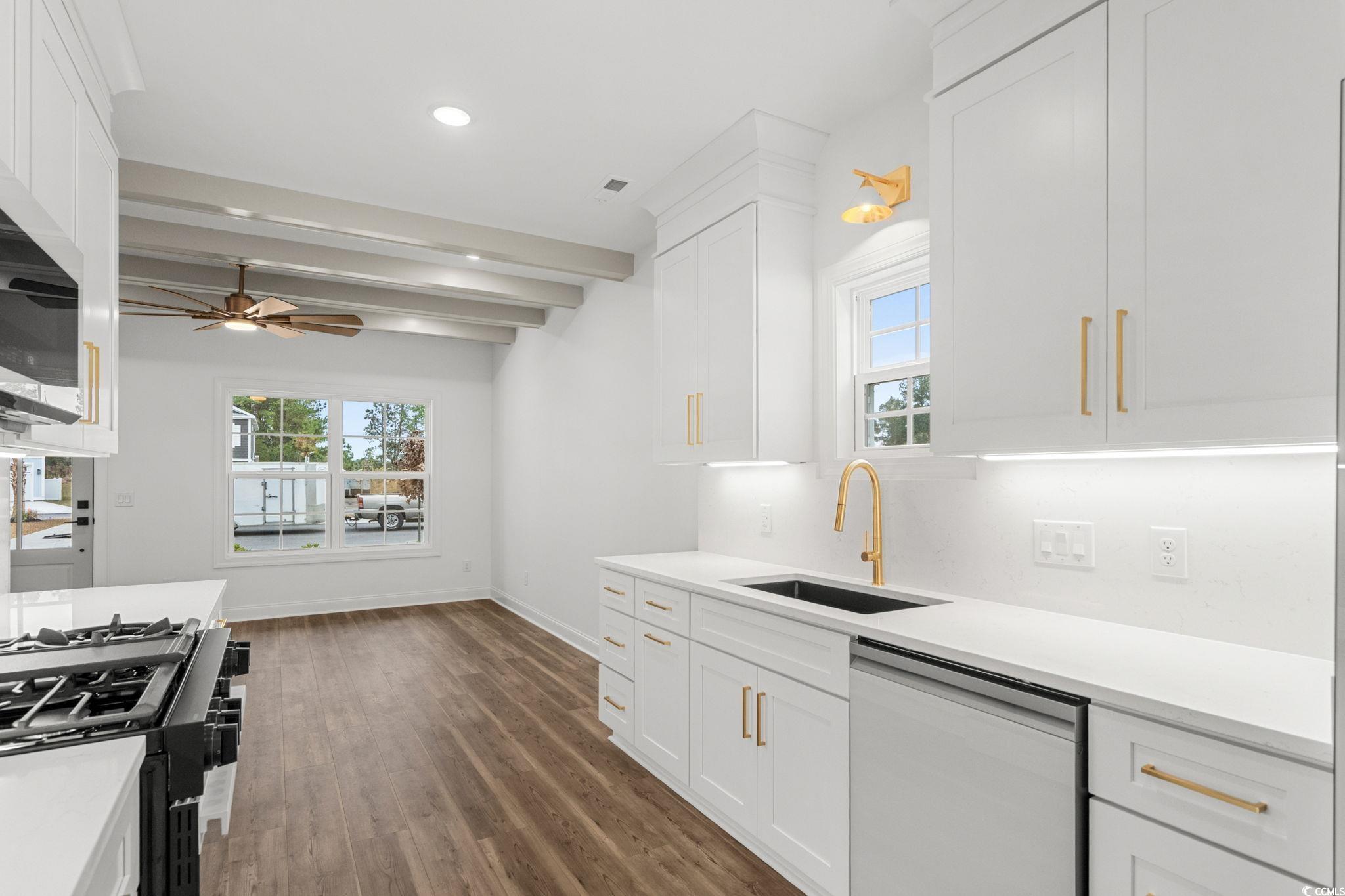164 Arbor Ridge Circle Conway, SC 29526 - Photo 11 of 38 Kitchen with plenty of natural light, dishwasher, white cabinets, beamed ceiling, and gas range