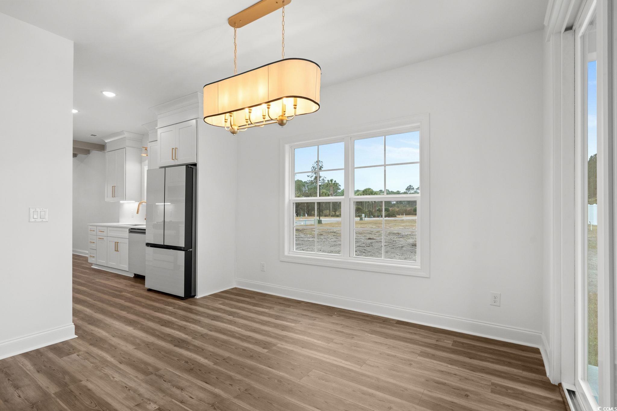 164 Arbor Ridge Circle Conway, SC 29526 - Photo 15 of 38 Unfurnished dining area with dark wood-style flooring and recessed lighting