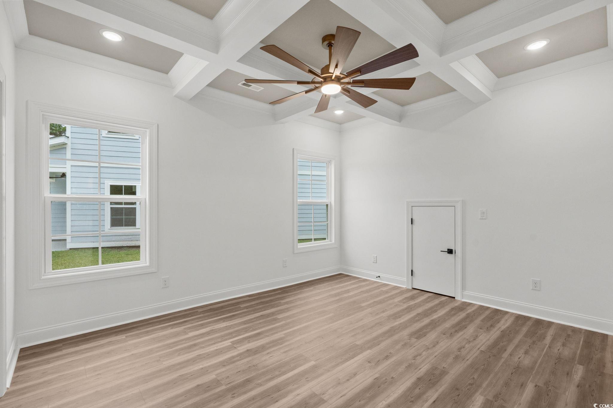 164 Arbor Ridge Circle Conway, SC 29526 - Photo 20 of 38 Spare room featuring coffered ceiling, light wood-type flooring, beam ceiling, a ceiling fan, and ornamental molding