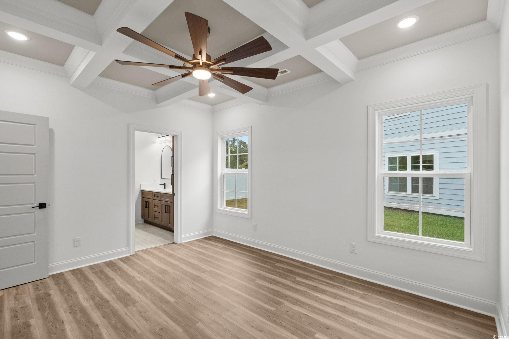 164 Arbor Ridge Circle Conway, SC 29526 - Photo 21 of 38 Unfurnished bedroom with coffered ceiling, light wood-style floors, ceiling fan, beamed ceiling, and ensuite bathroom