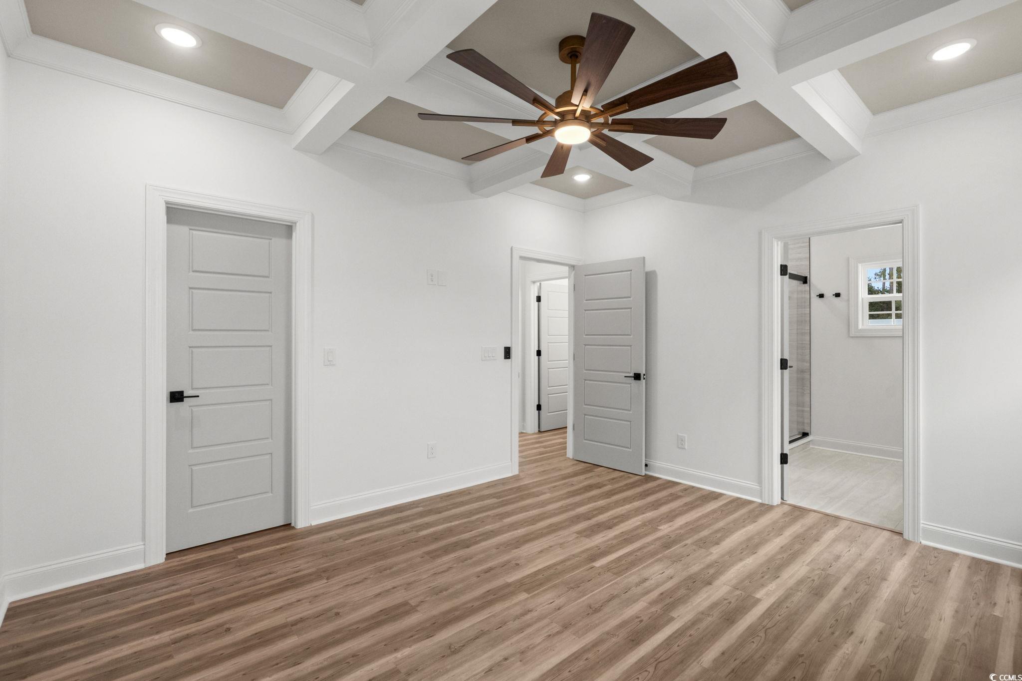 164 Arbor Ridge Circle Conway, SC 29526 - Photo 22 of 38 Unfurnished bedroom with coffered ceiling, beamed ceiling, wood finished floors, recessed lighting, and ceiling fan