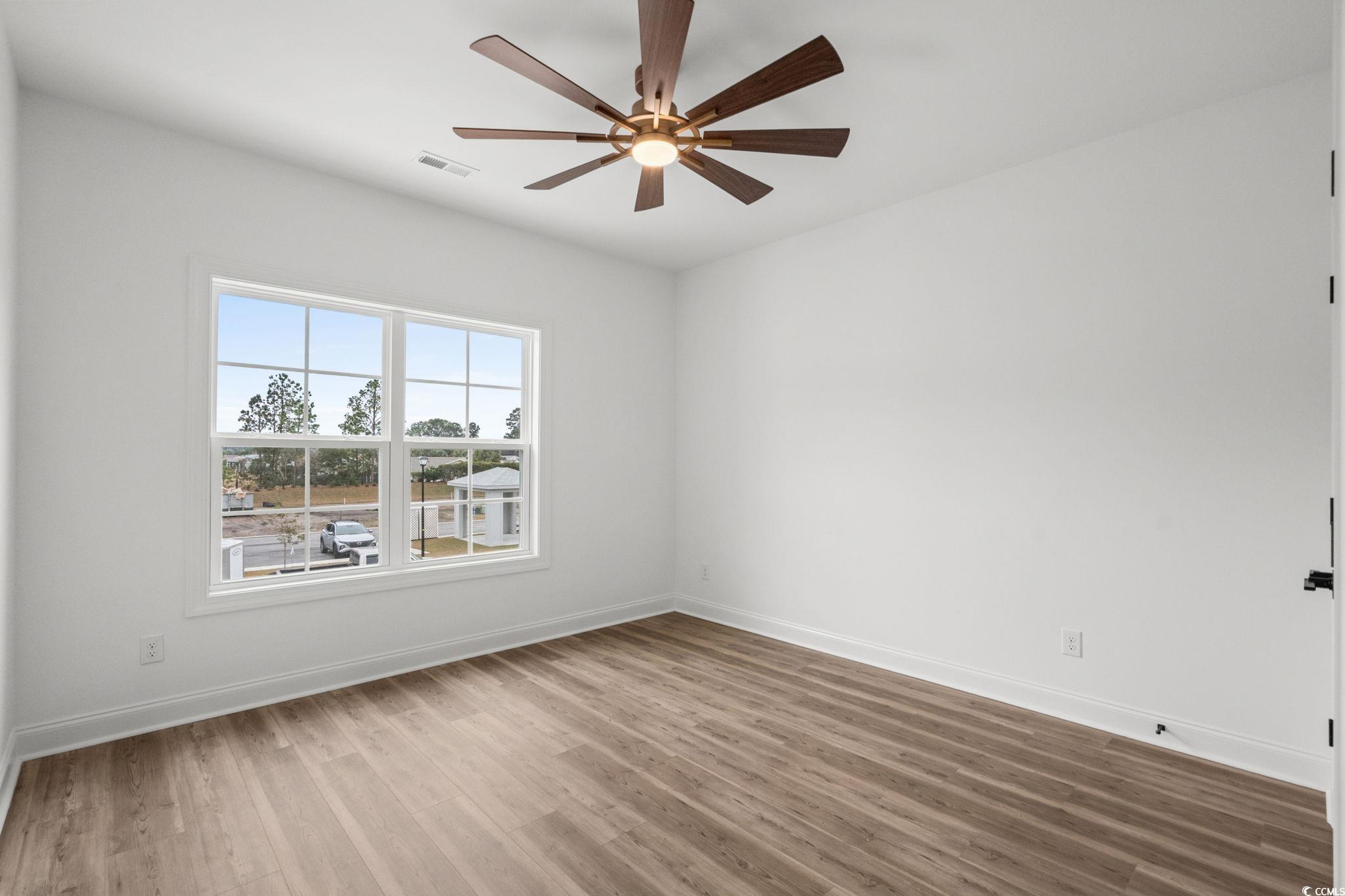 164 Arbor Ridge Circle Conway, SC 29526 - Photo 29 of 38 Empty room with wood finished floors and ceiling fan
