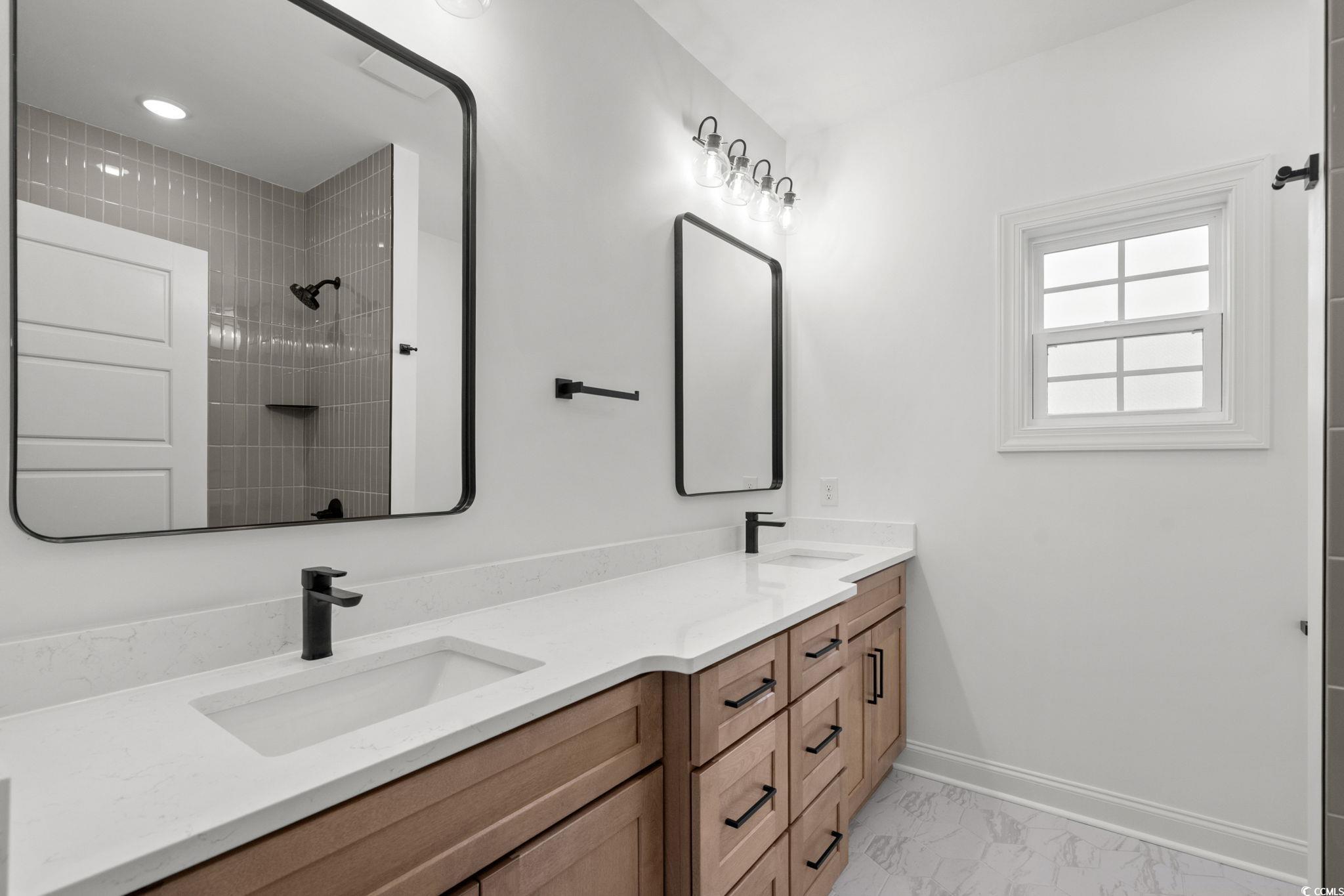164 Arbor Ridge Circle Conway, SC 29526 - Photo 31 of 38 Full bath featuring light marble finish floors, double vanity, and tiled shower