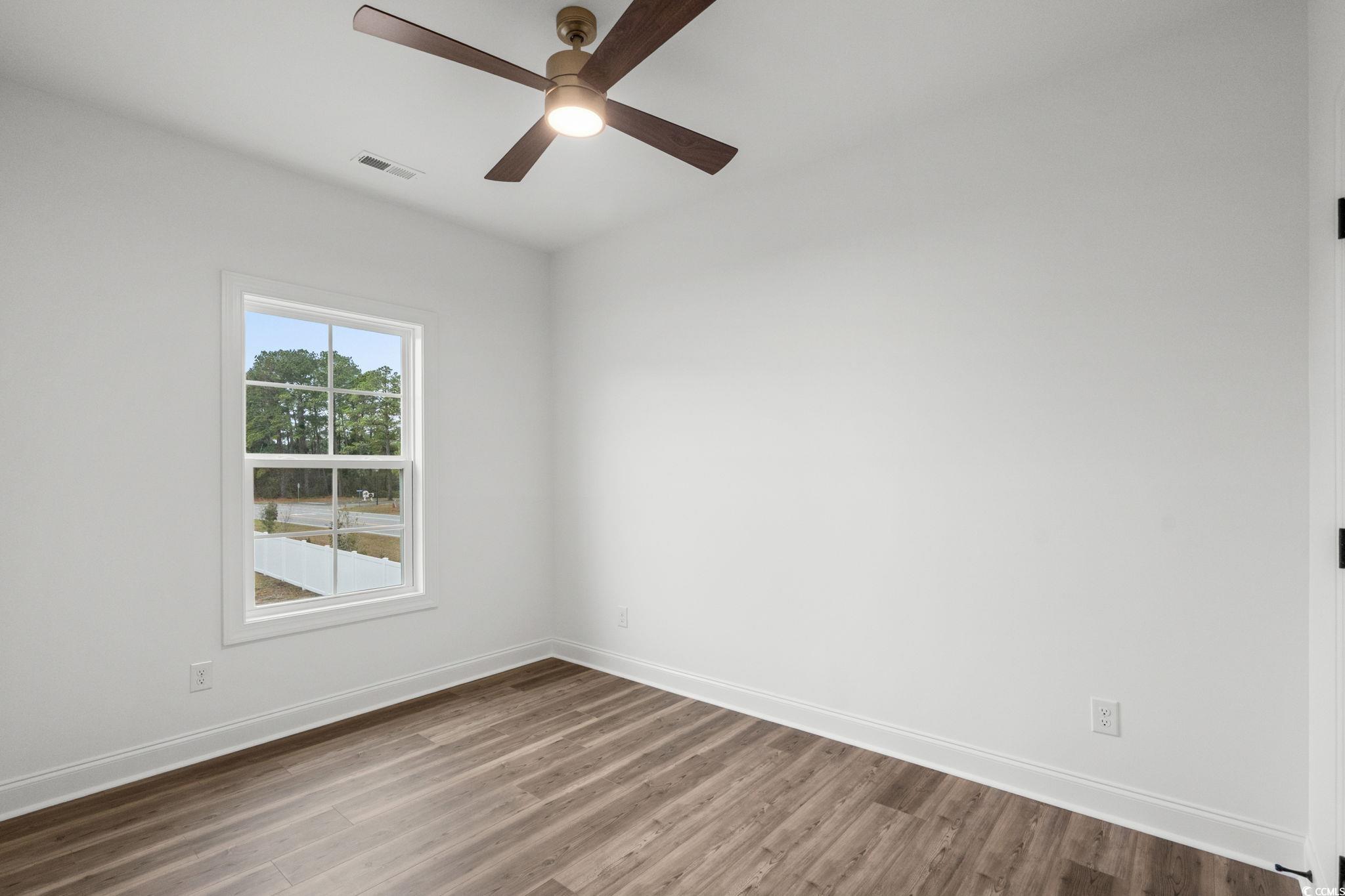 164 Arbor Ridge Circle Conway, SC 29526 - Photo 33 of 38 Empty room with wood finished floors and a ceiling fan