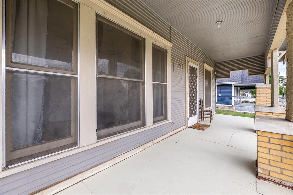 719 West Tarleton Street Stephenville, TX 76401 - Photo 2 of 30 a view of a room with a large window