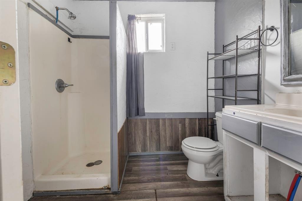 719 West Tarleton Street Stephenville, TX 76401 - Photo 23 of 30 a bathroom with a sink and a toilet
