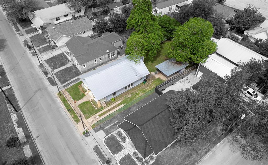 719 West Tarleton Street Stephenville, TX 76401 - Photo 30 of 30 an aerial view of a house with a garden and trees