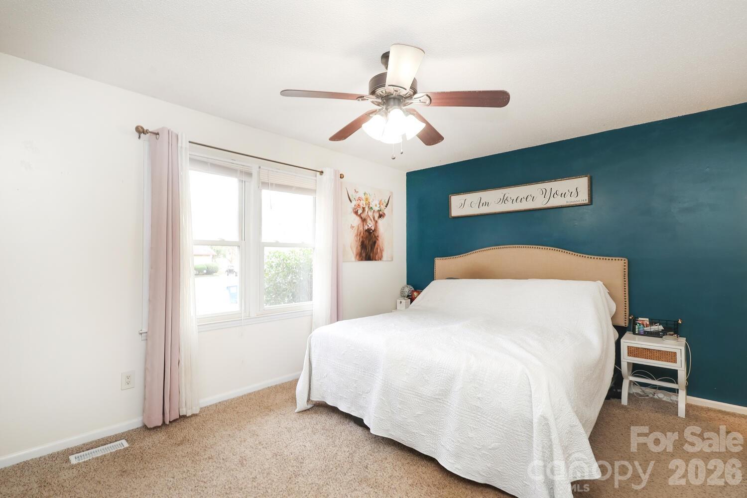 210 King George Lane Gastonia, NC 28056 - Photo 13 of 19 a bedroom with a bed and a window