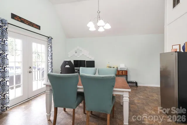 a kitchen with stainless steel appliances granite countertop a refrigerator a stove and a sink