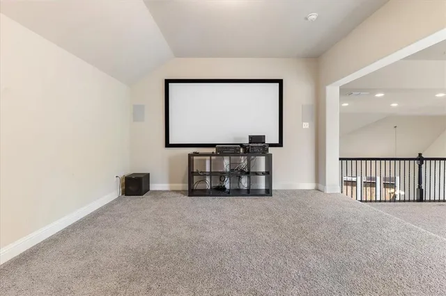 a view of empty room with a fireplace