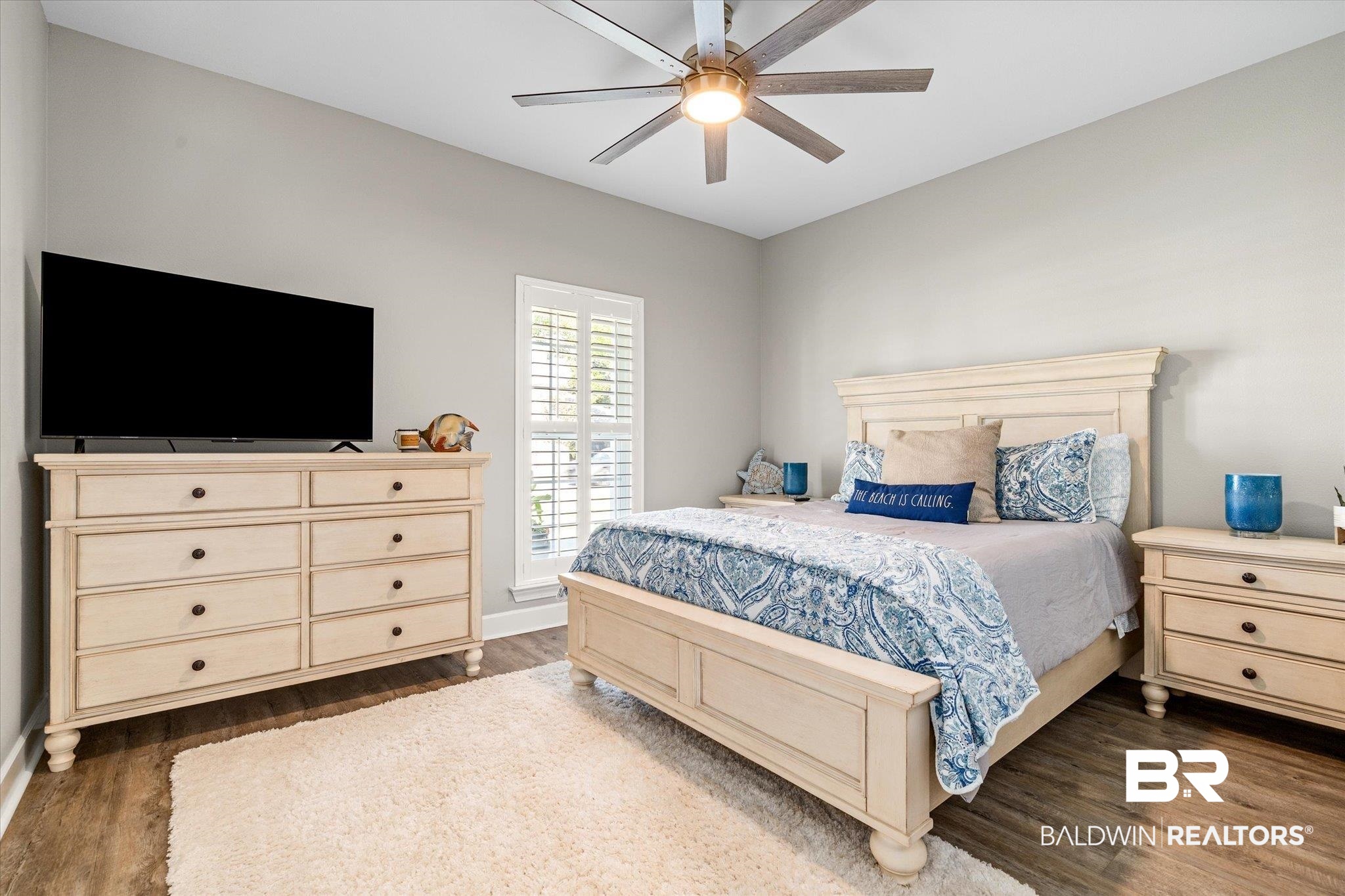 4947 Look Rook Road Orange Beach, AL 36561 - Photo 16 of 24 Bedroom featuring baseboards, a ceiling fan, and dark wood finished floors