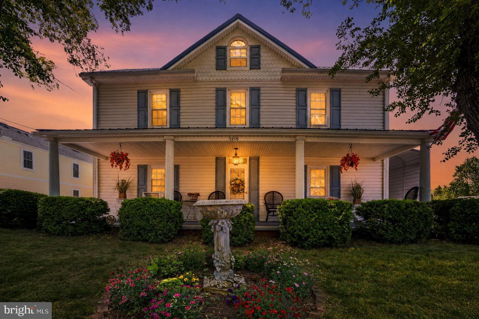 7215 Benedict Avenue Benedict, MD 20612 - Photo 1 of 47 a front view of a house with garden