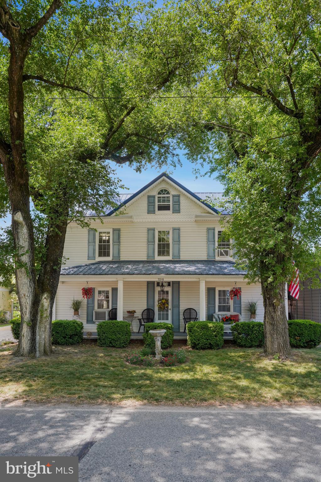 7215 Benedict Avenue Benedict, MD 20612 - Photo 15 of 47 a front view of a house with a yard