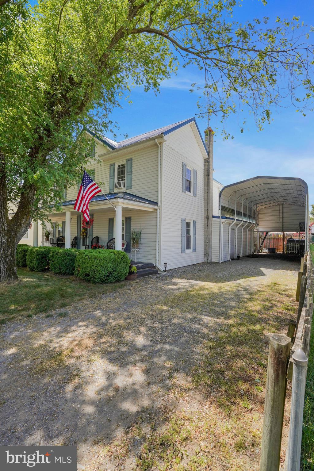 7215 Benedict Avenue Benedict, MD 20612 - Photo 21 of 47 a front view of a house with a yard