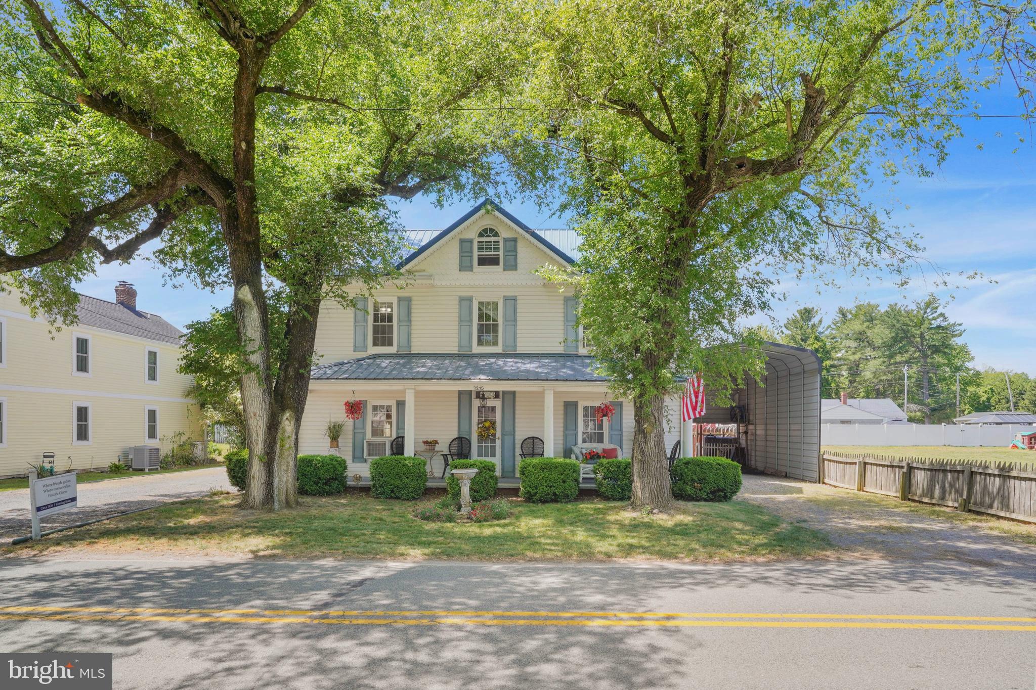 7215 Benedict Avenue Benedict, MD 20612 - Photo 27 of 47 a front view of a house with a yard