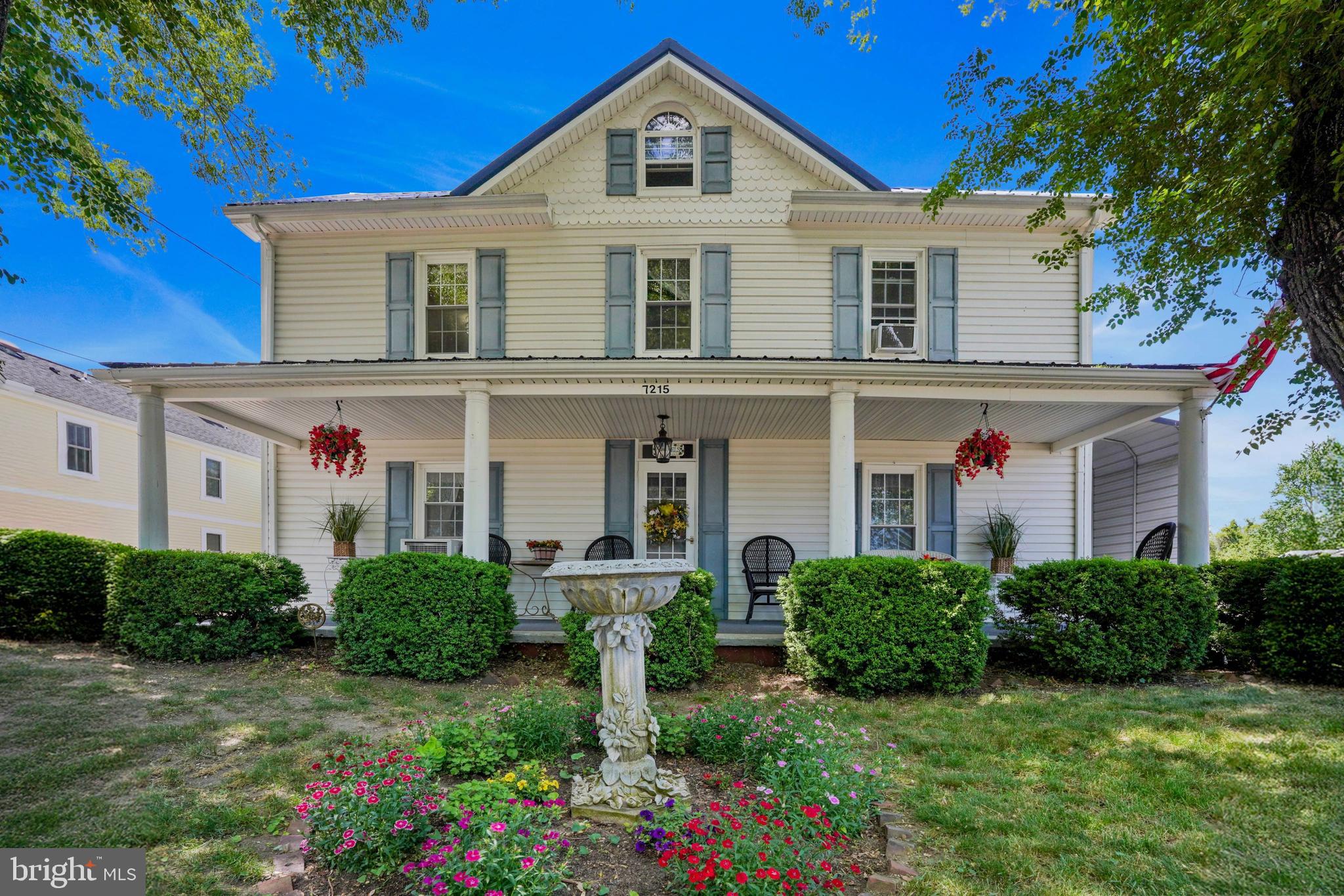 7215 Benedict Avenue Benedict, MD 20612 - Photo 28 of 47 a front view of a house with a yard