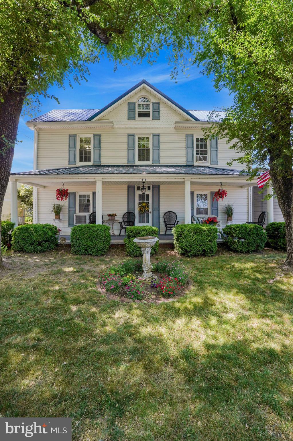 7215 Benedict Avenue Benedict, MD 20612 - Photo 3 of 47 a front view of a house with a yard