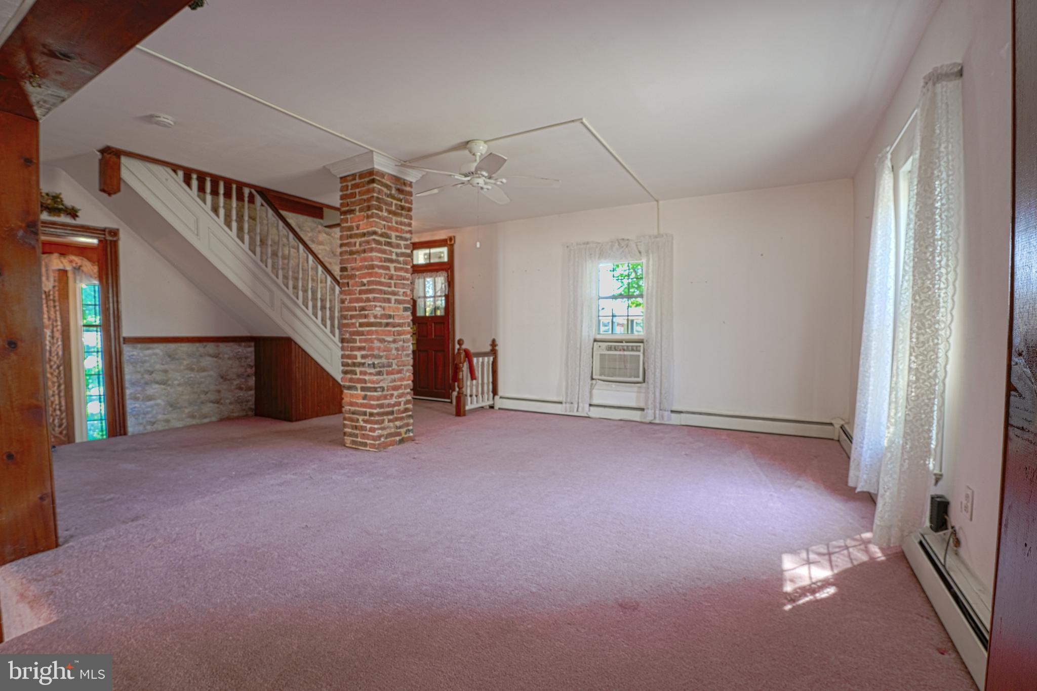7215 Benedict Avenue Benedict, MD 20612 - Photo 36 of 47 a view of empty room with fireplace and windows