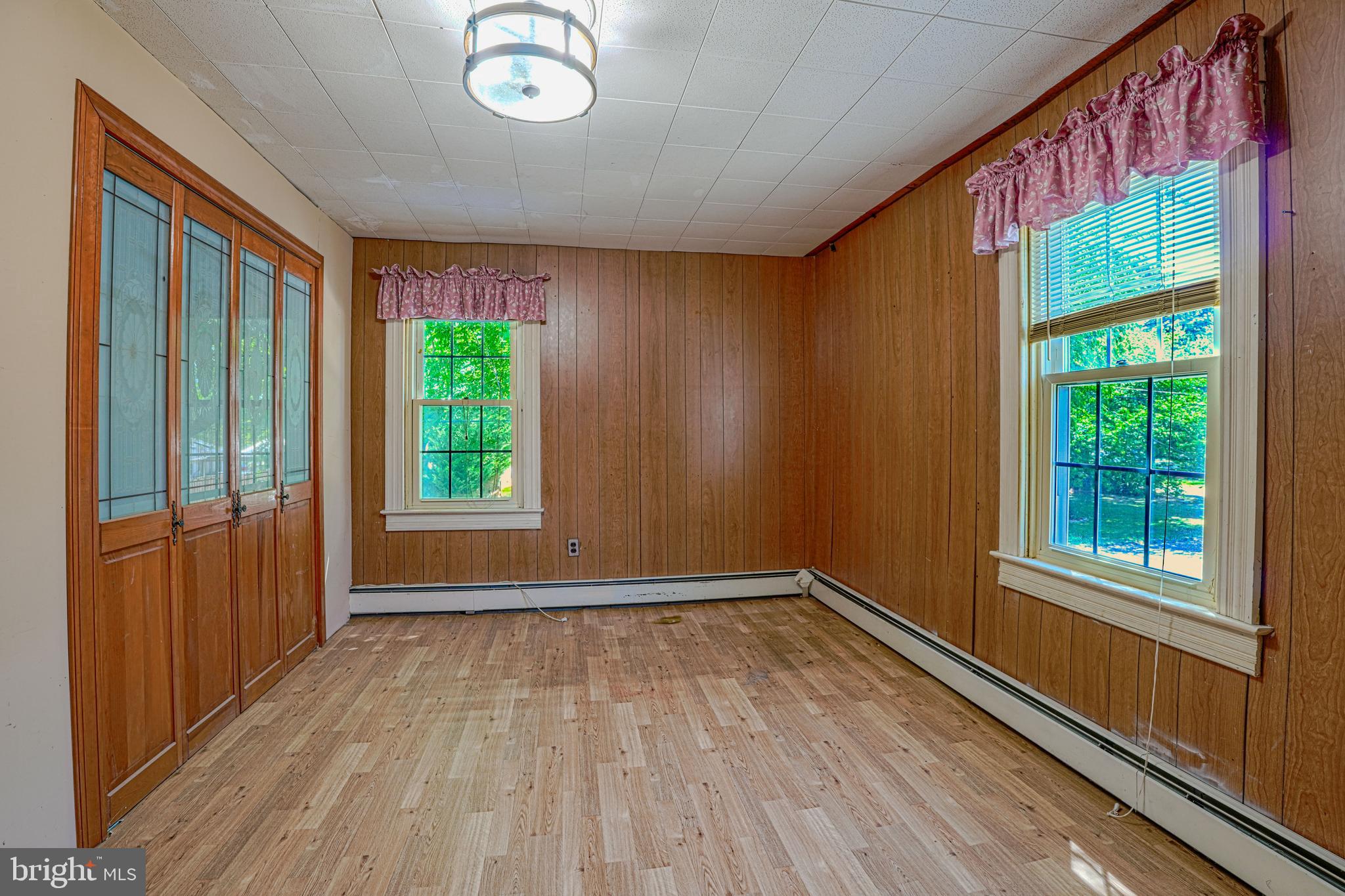 7215 Benedict Avenue Benedict, MD 20612 - Photo 38 of 47 a view of empty room with wooden floor and fan