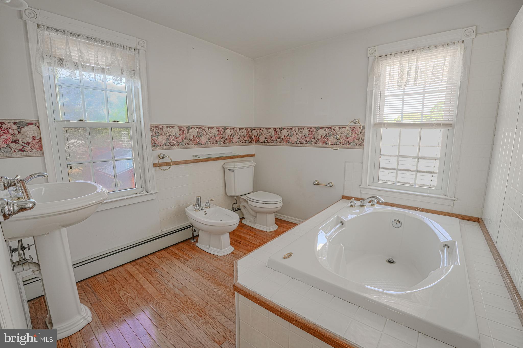 7215 Benedict Avenue Benedict, MD 20612 - Photo 41 of 47 a bathroom with a sink and a large mirror
