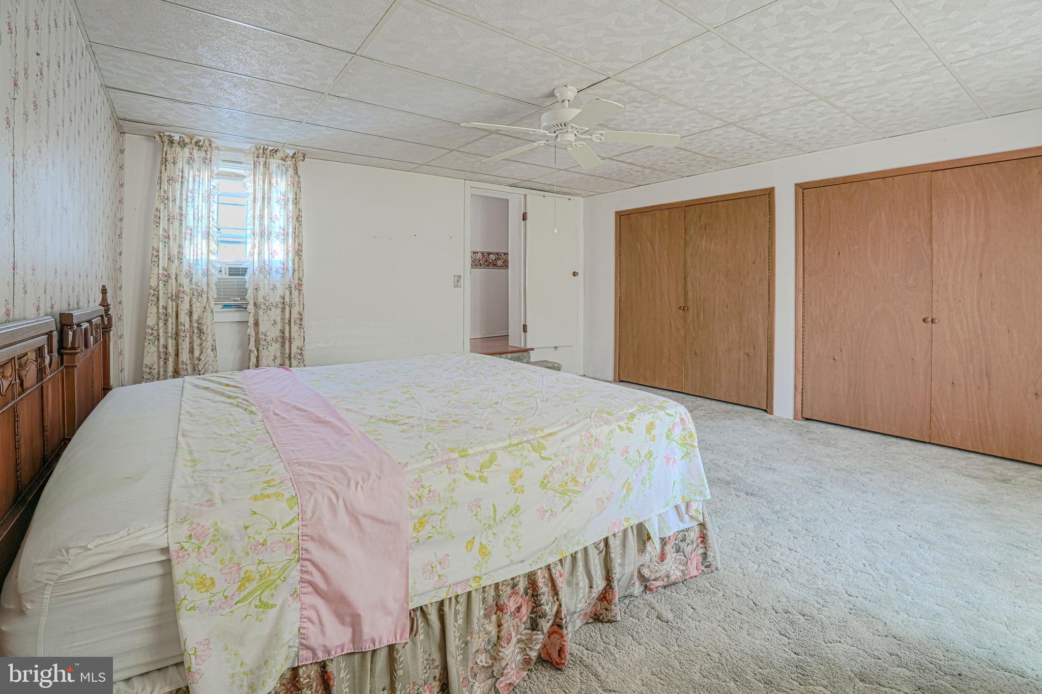 7215 Benedict Avenue Benedict, MD 20612 - Photo 44 of 47 a bedroom with a bed and a window