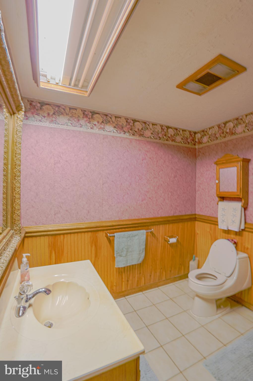 7215 Benedict Avenue Benedict, MD 20612 - Photo 46 of 47 a bathroom with a sink and a bathtub