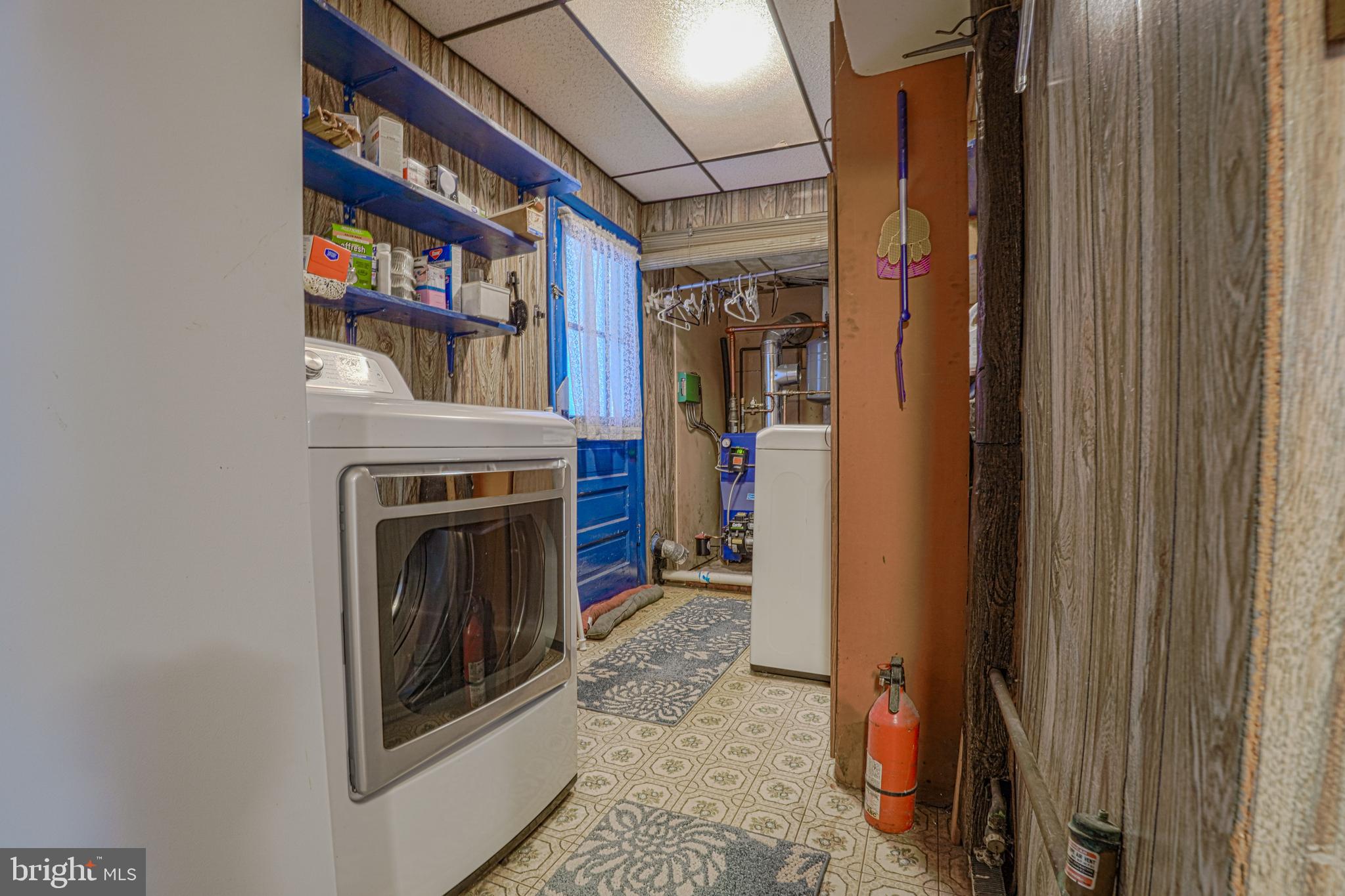 7215 Benedict Avenue Benedict, MD 20612 - Photo 47 of 47 a view of a hallway with washer and dryer