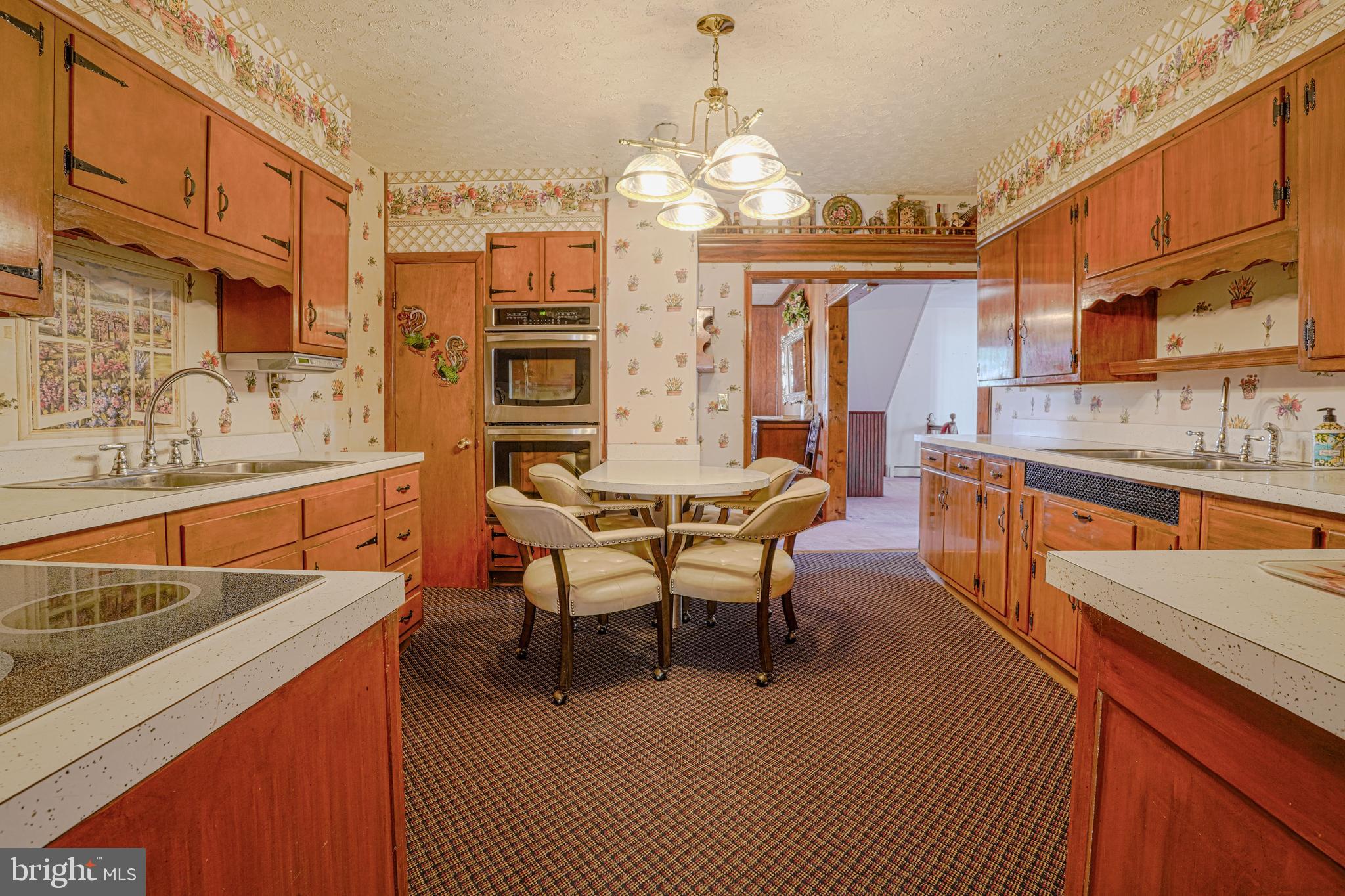 7215 Benedict Avenue Benedict, MD 20612 - Photo 9 of 47 a view of a dining room with furniture and chandelier