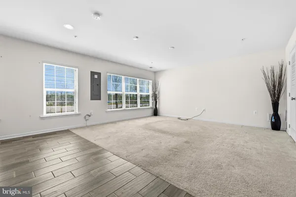 a kitchen with stainless steel appliances granite countertop a stove and a microwave