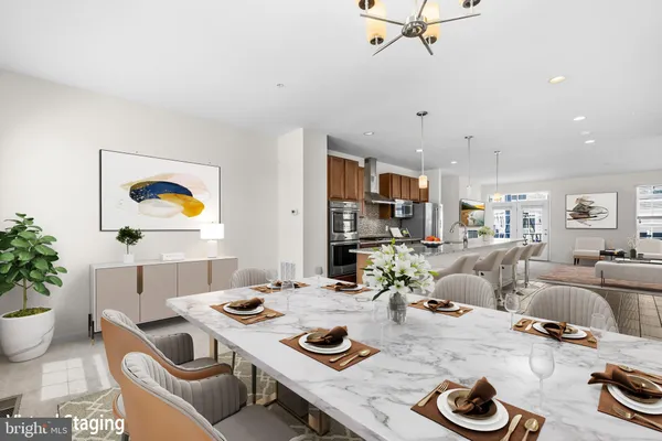 a kitchen with stainless steel appliances granite countertop a stove and cabinets