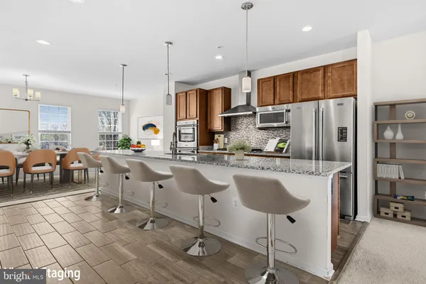 a bedroom with a large bed and a couch