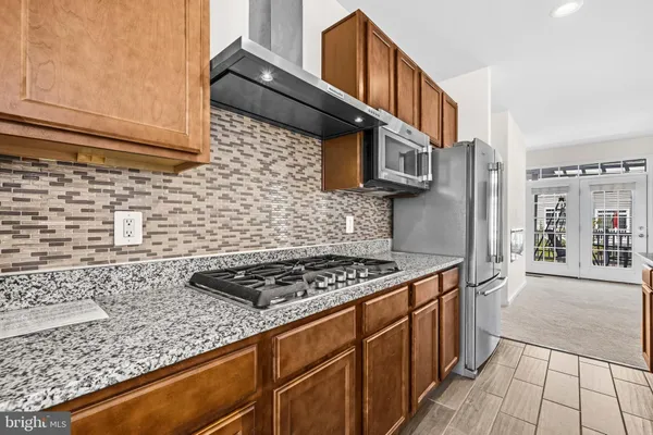 an empty room with windows and entrance