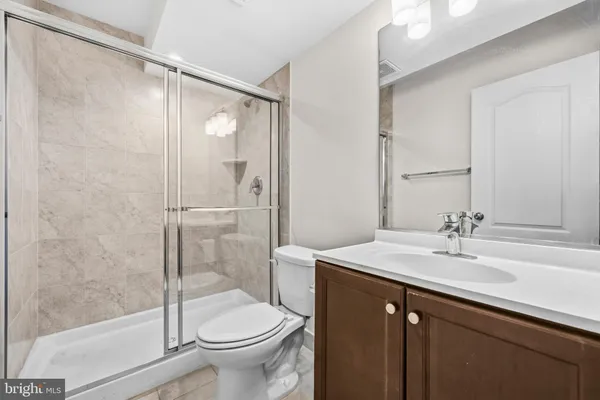 an aerial view of a house with swimming pool and ocean view