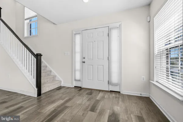 a view of a kitchen with furniture and a window