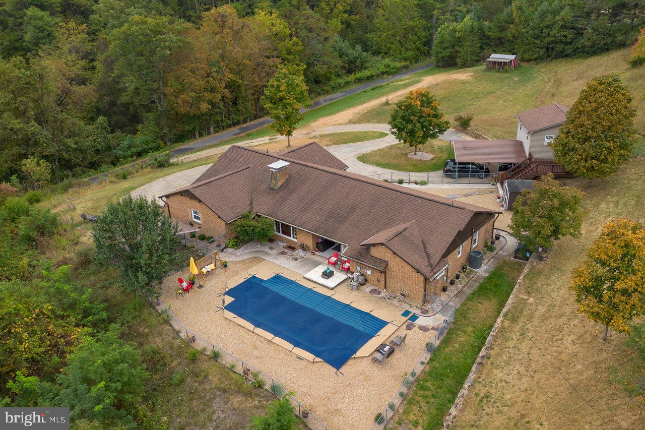 an aerial view of a house with a garden