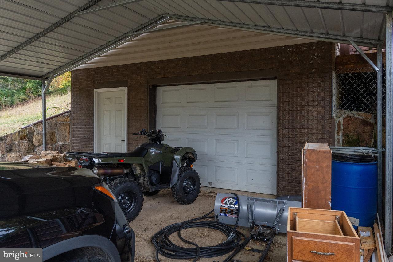 120 Galen Hedrick Road Franklin, WV 26807 - Photo 102 of 115 Covered parking with outdoor adventure gear.