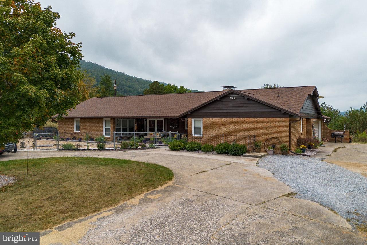 120 Galen Hedrick Road Franklin, WV 26807 - Photo 113 of 115 a front view of a house with swimming pool having outdoor seating