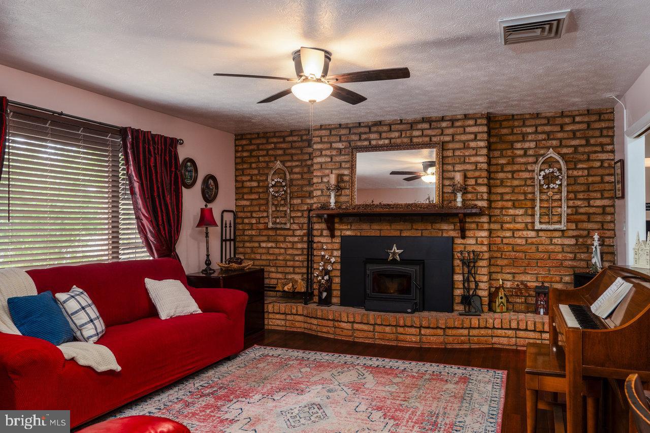 120 Galen Hedrick Road Franklin, WV 26807 - Photo 39 of 115 a living room with furniture and a fireplace