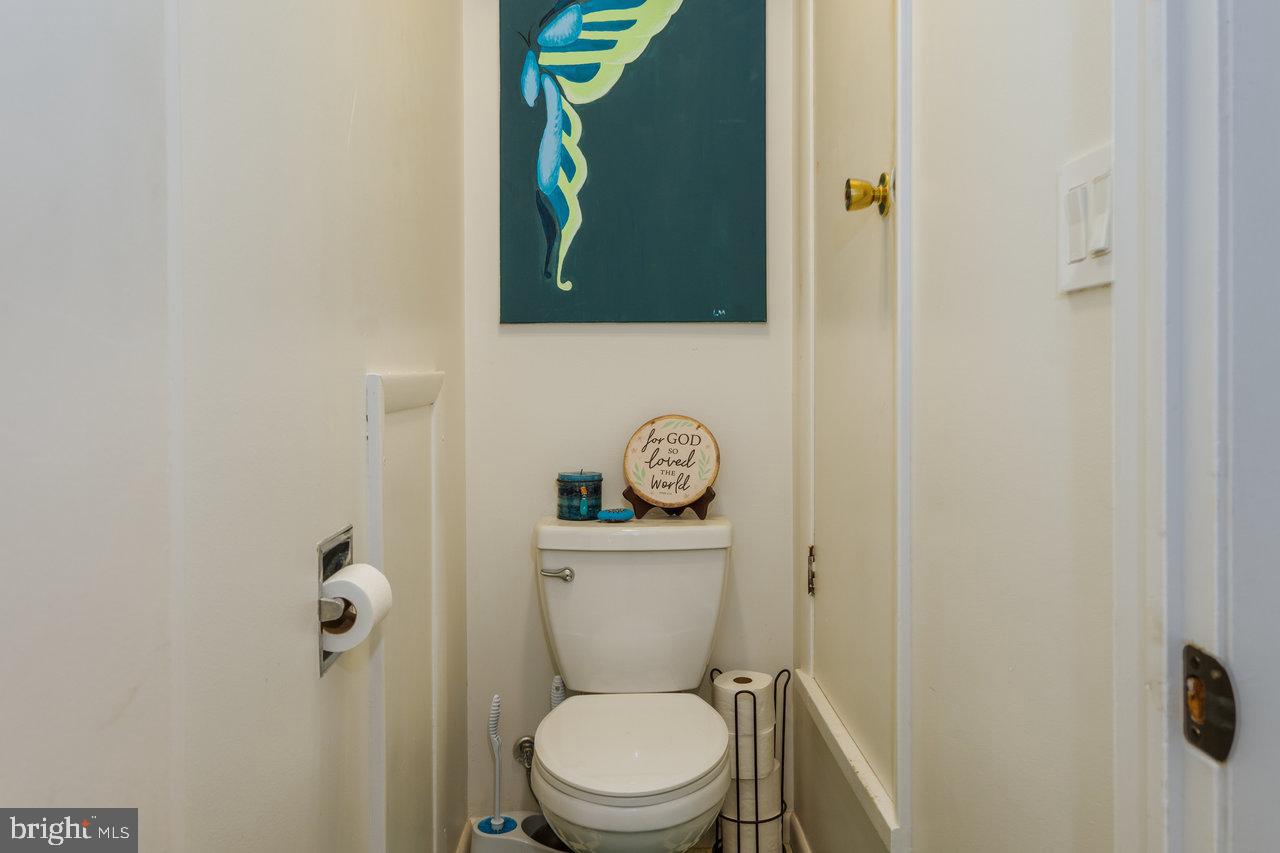 120 Galen Hedrick Road Franklin, WV 26807 - Photo 55 of 115 a white toilet sitting next to a shower curtain