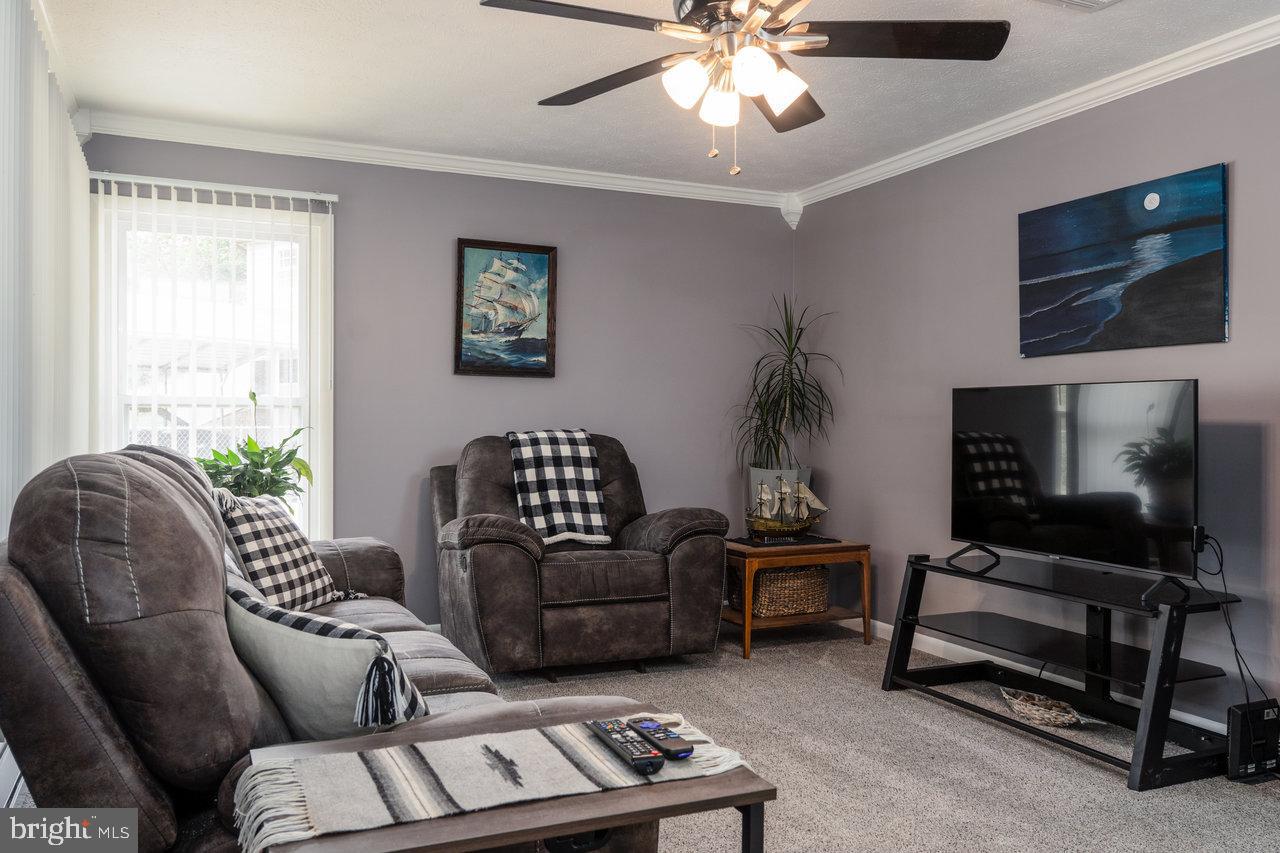 120 Galen Hedrick Road Franklin, WV 26807 - Photo 58 of 115 a living room with furniture a flat screen tv and a window