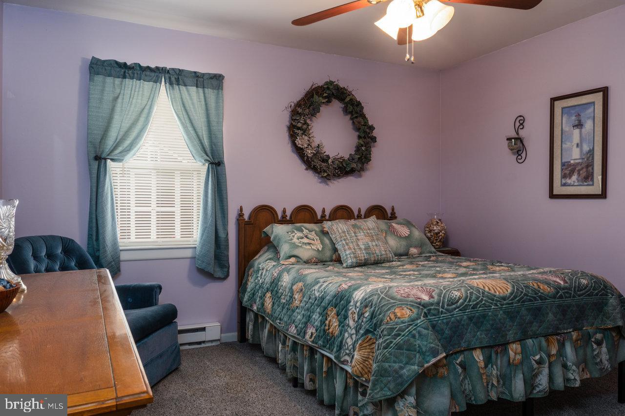 120 Galen Hedrick Road Franklin, WV 26807 - Photo 59 of 115 a bedroom with a bed mirror and window